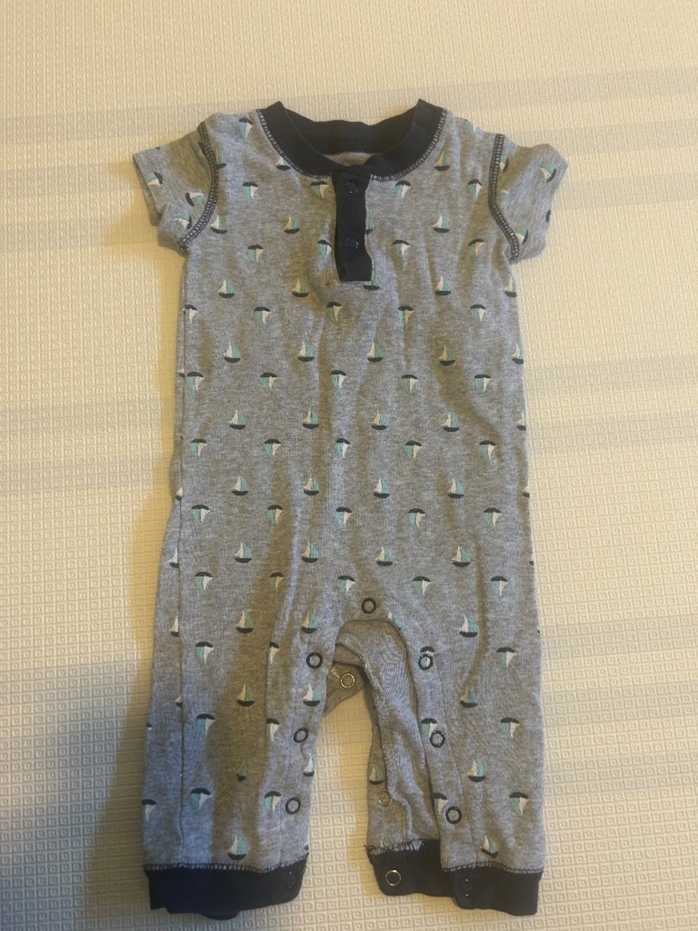 George baby onsie with sailboat patter